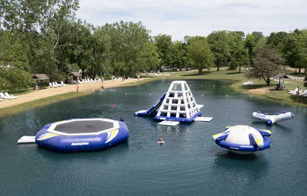 aerial view of swimming pond and Aquaglide water inflatables